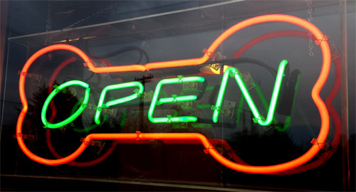 Open sign shaped like a dog bone